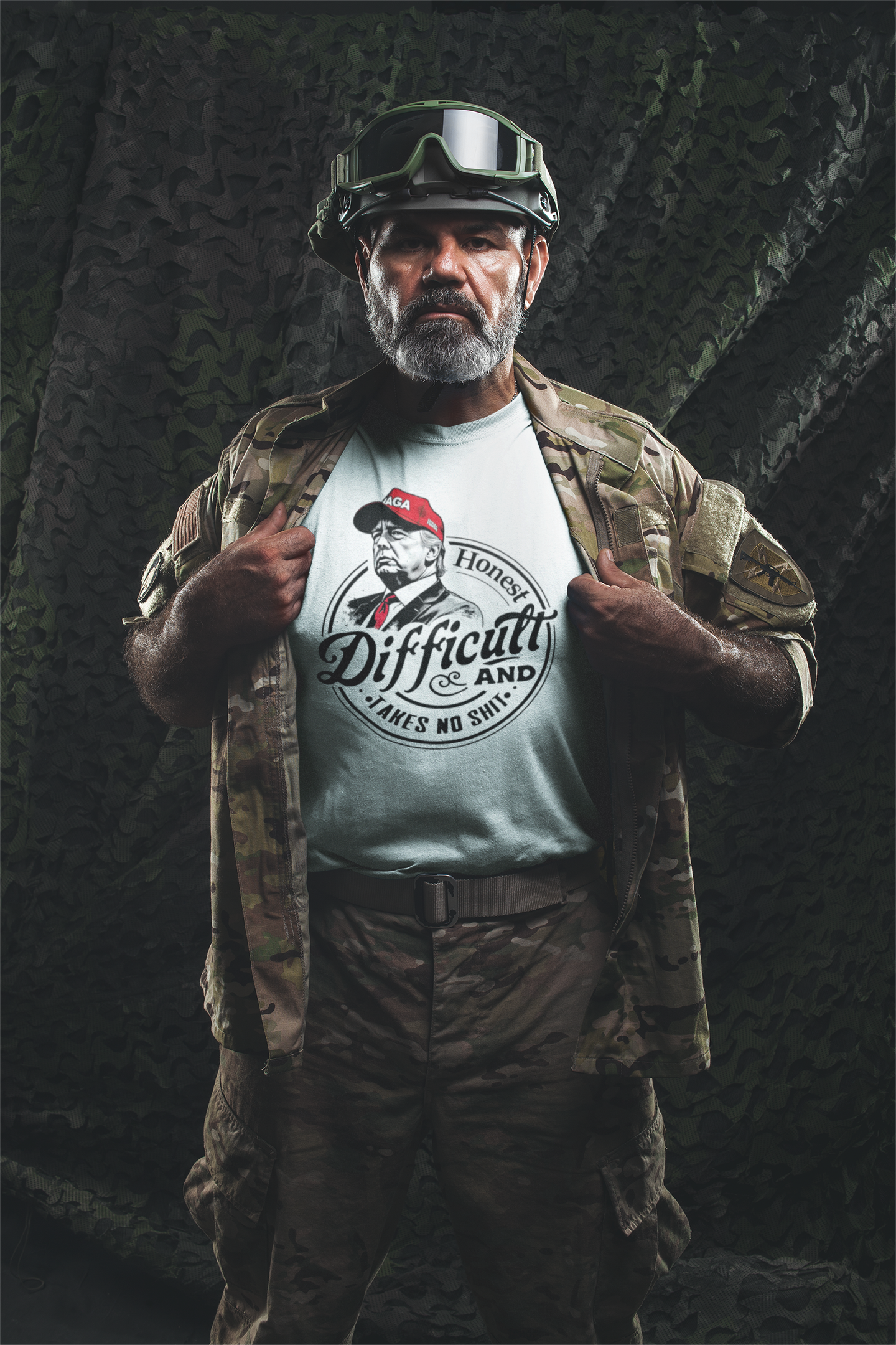 Man in military gear showcasing True Tough Takes No Shit Design graphic tee with camouflage background.