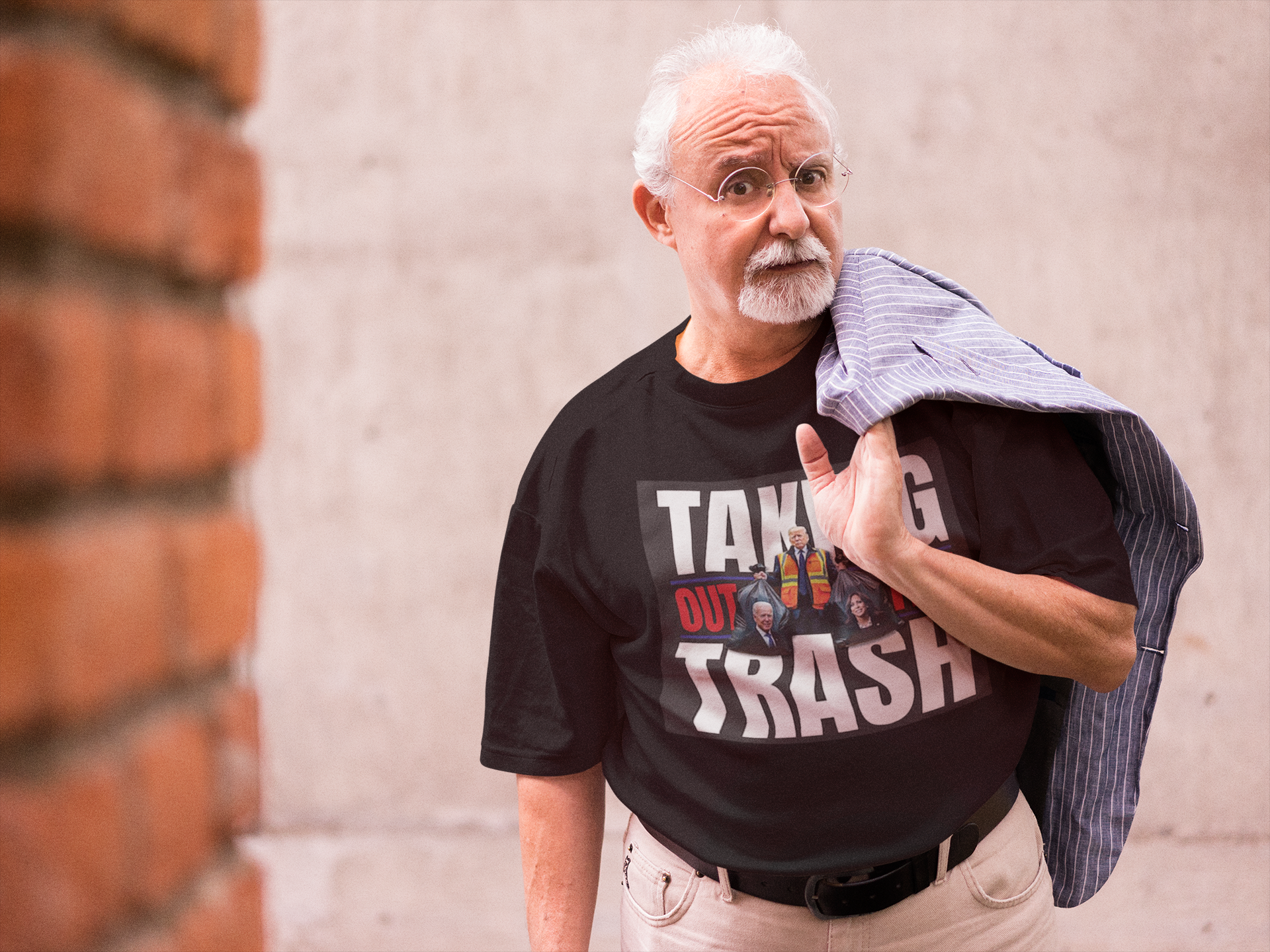 Older man wearing Taking Out The Trash Graphic Art tee, confidently expressing personal values.