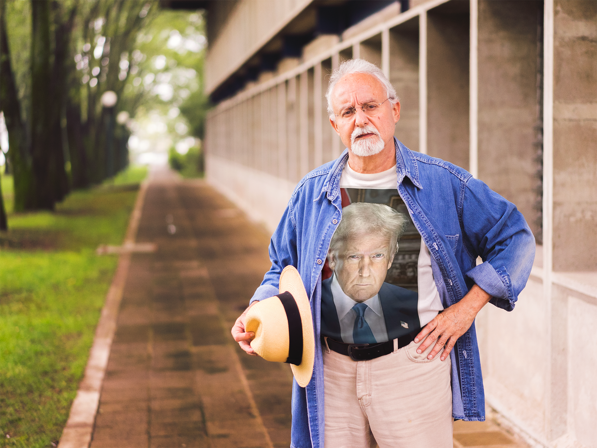 A man wearing a Serious Trump Portrait Graphic tee stands outdoors, showcasing his support for his values.