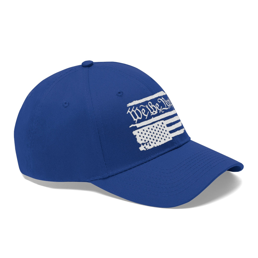 We The People On Distressed American Flag Twill Cap in blue, featuring a white distressed flag design.