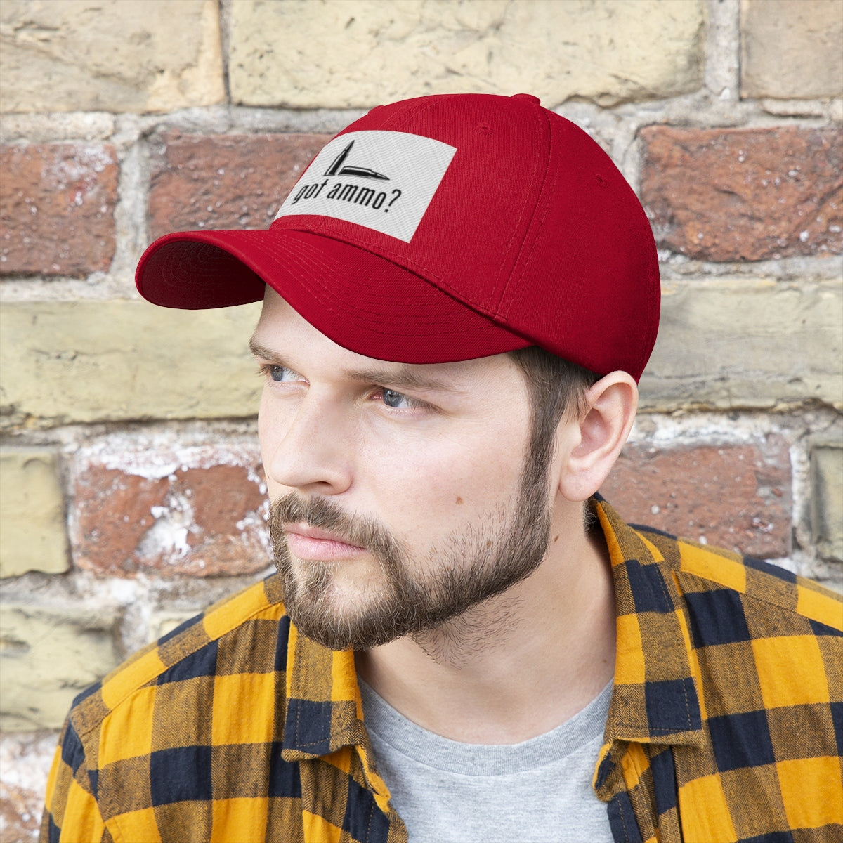 Got Ammo Twill Cap Funny Tactical Style Cap worn by man with beard against a brick wall.
