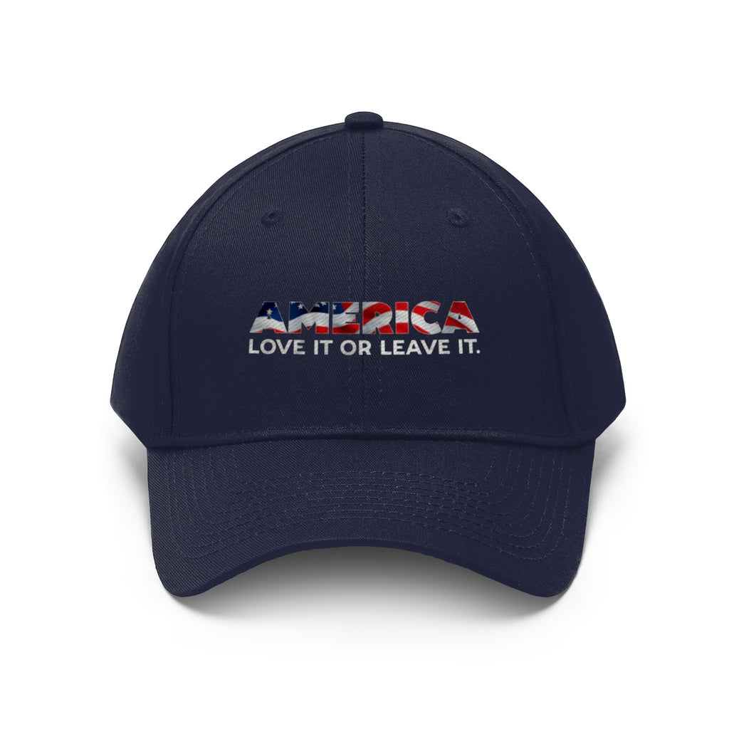 America Love It Or Leave It Twill Baseball Cap featuring patriotic text on a navy blue background.