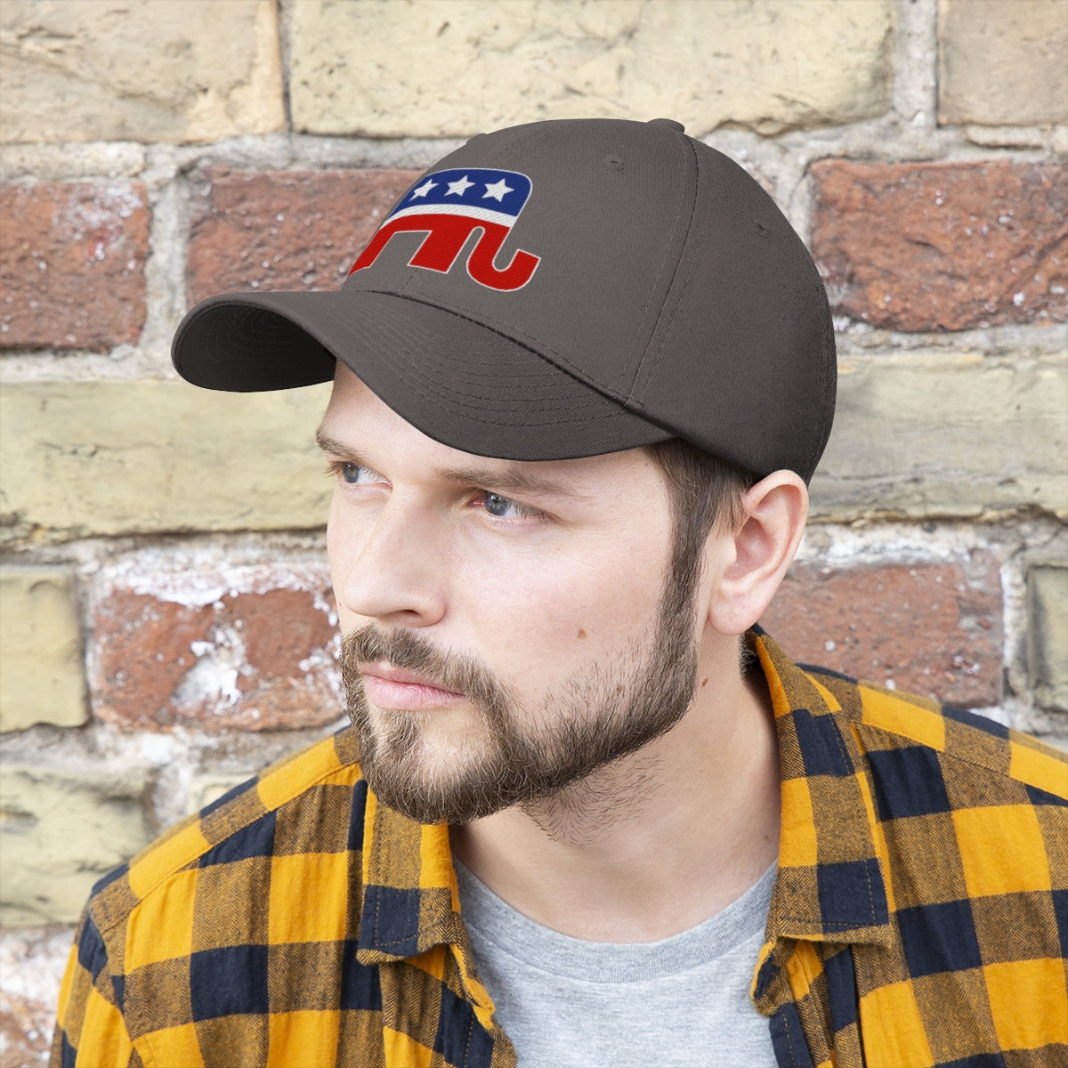 GOP Symbol Twill Cap Patriotic Political Graphic Cap worn by a man with a beard in front of a brick wall.
