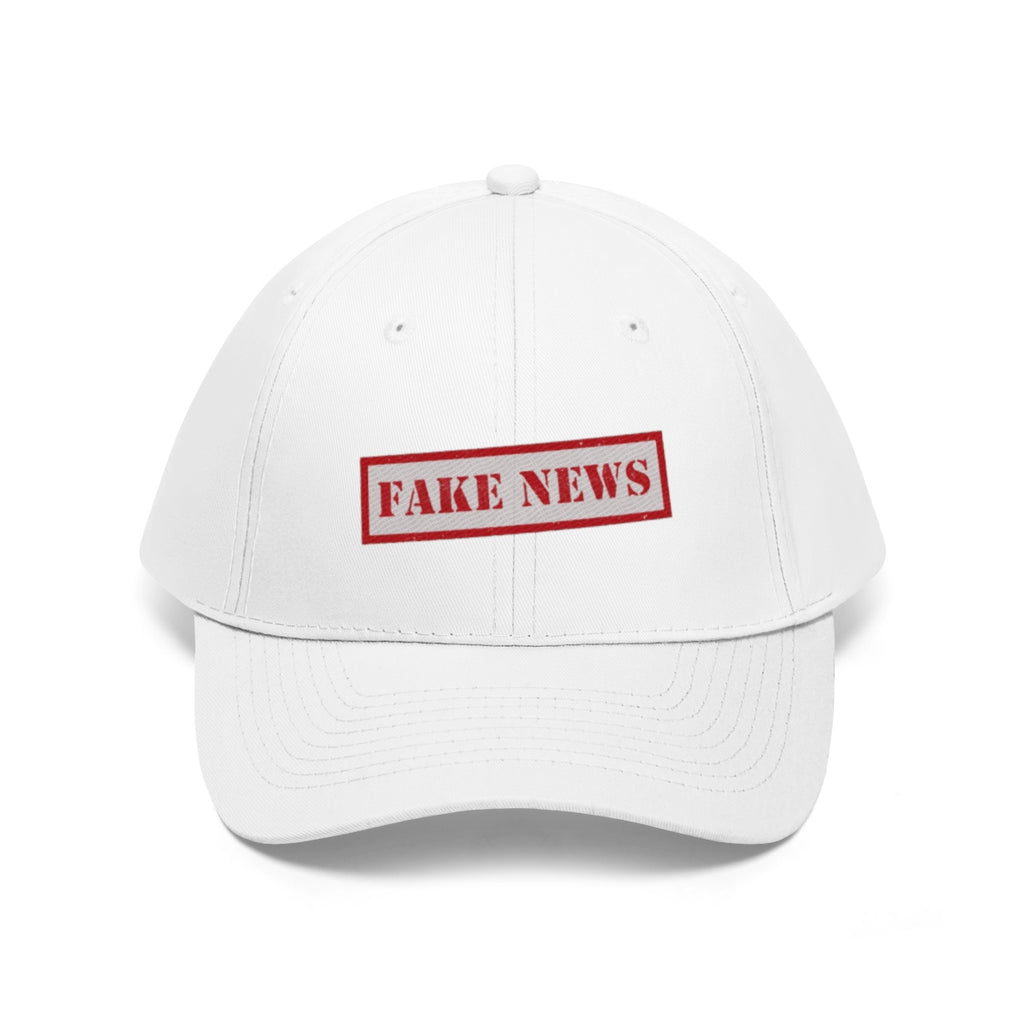 Fake News Twill Cap Bold Humor Casual Wear Hat displayed in white with red "FAKE NEWS" text.