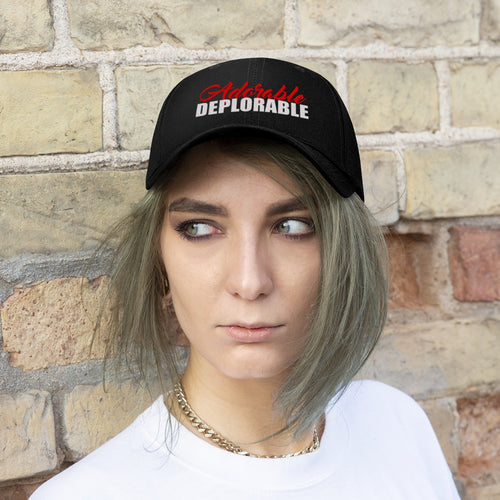 Adorable Deplorable Embroidered Twill Cap worn by a model with casual attire against a brick background.