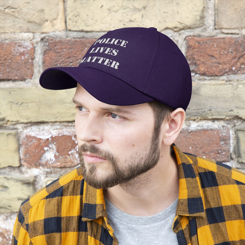 Embroidered Police Lives Matter Twill Cap on a man wearing a checkered shirt against a brick wall.