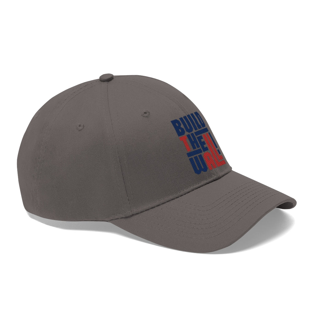 Build The Wall Twill Cap Classic Statement Wear Cap showcasing a gray baseball cap with bold text design.