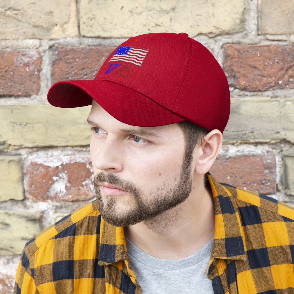 Man wearing Betsy Ross Flag 1776 Twill Cap in red with flag design