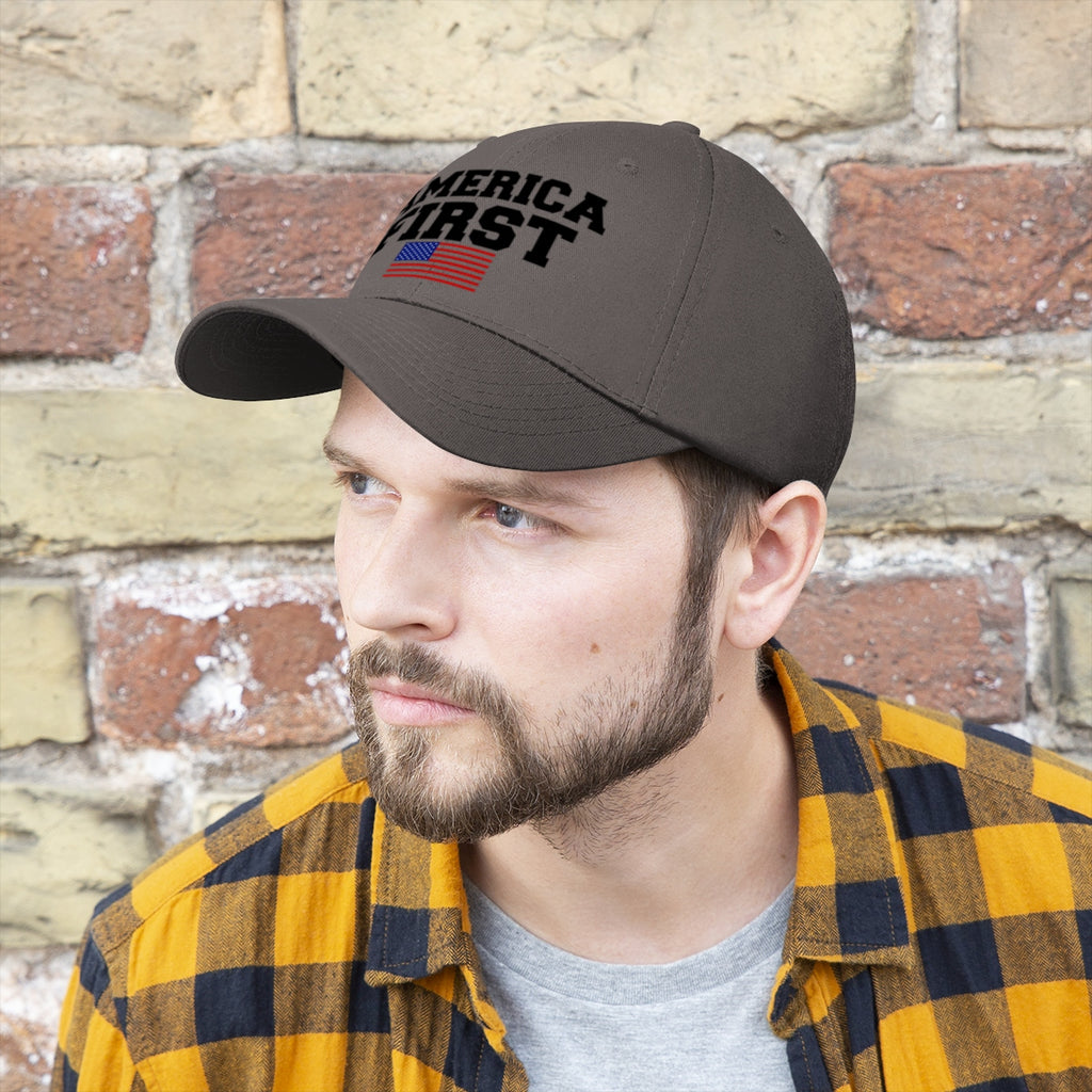 America First Patriotic Twill Cap worn by man against brick wall, showcasing national pride.