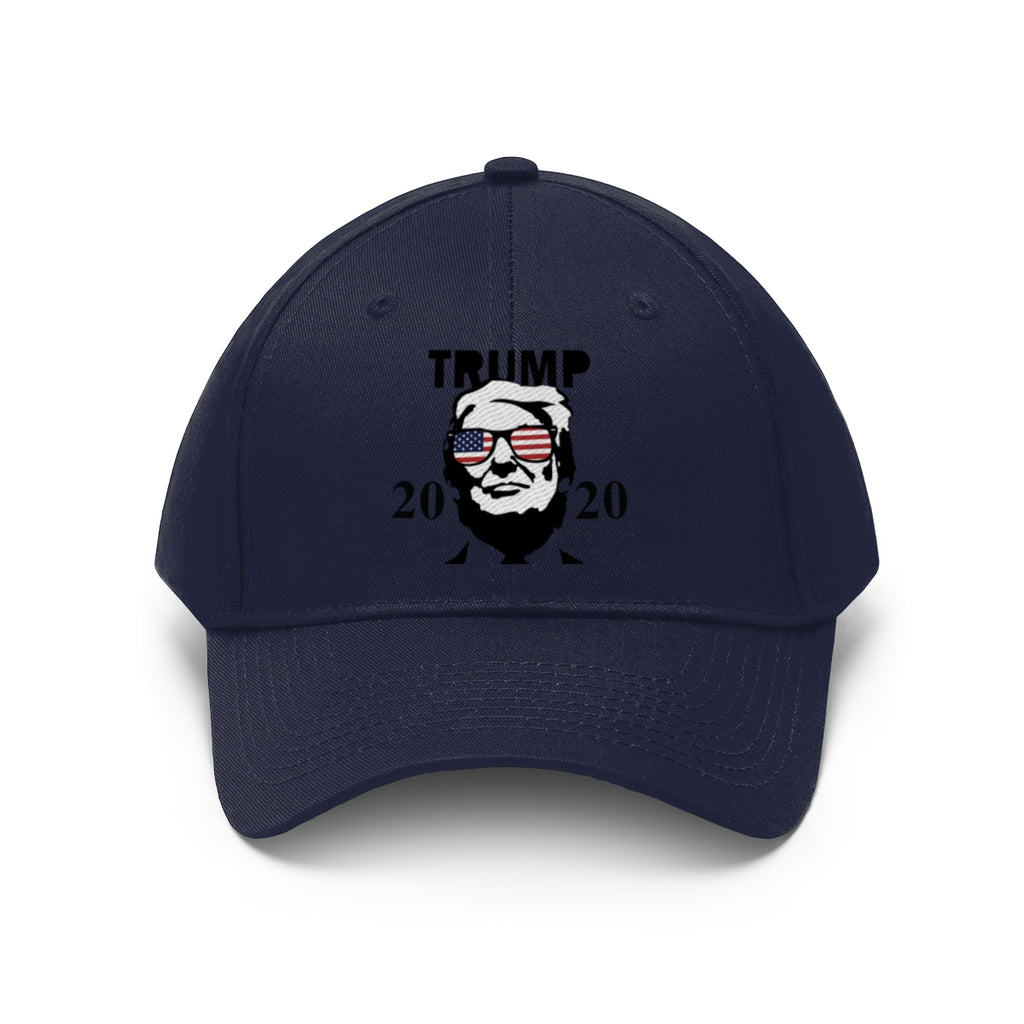 Trump 2020 With US Flag Glasses Twill Cap featuring a presidential design on a navy blue cap.
