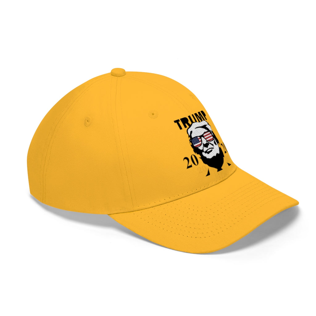 Trump 2020 With US Flag Glasses Twill Cap in yellow featuring a bold political design.