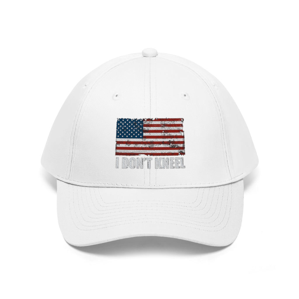 I Don't Kneel American Flag Twill Cap featuring a distressed American flag design on a white cap.