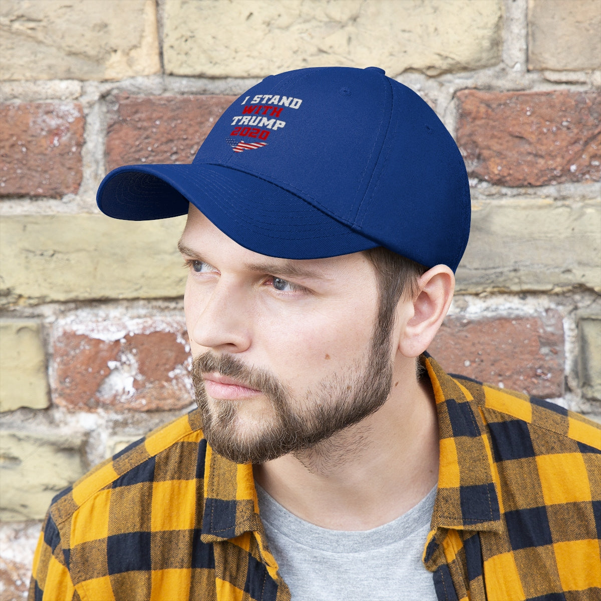 Man wearing I Stand With Trump 2020 Twill Cap with blue background and plaid shirt.