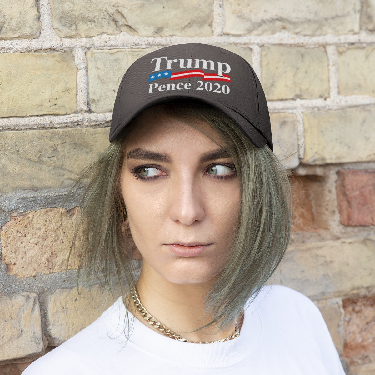 Trump Pence 2020 American Flag Twill Cap worn by model against a brick wall background.
