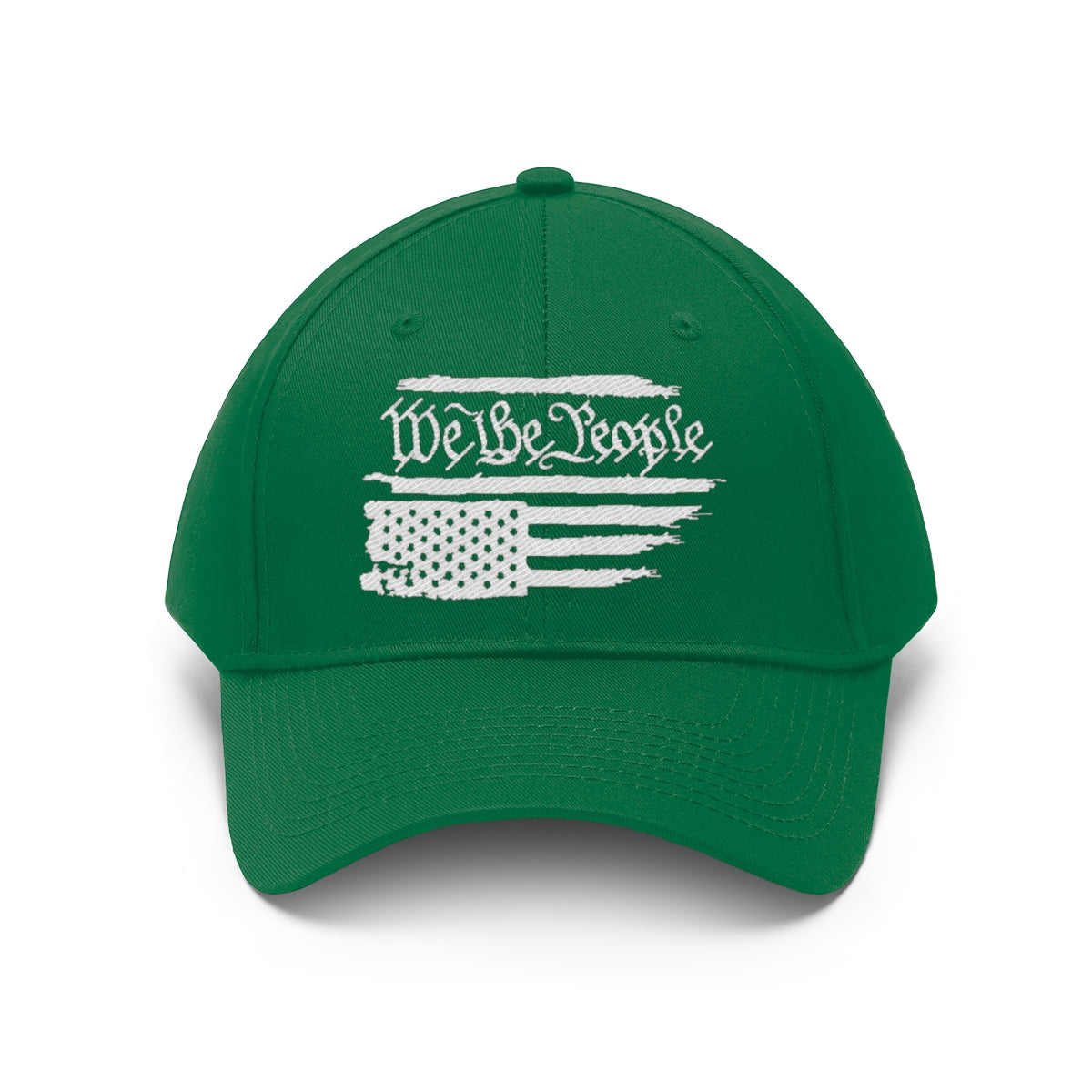 We The People On Distressed American Flag Twill Cap on a green background, showcasing patriotic design and bold statement.