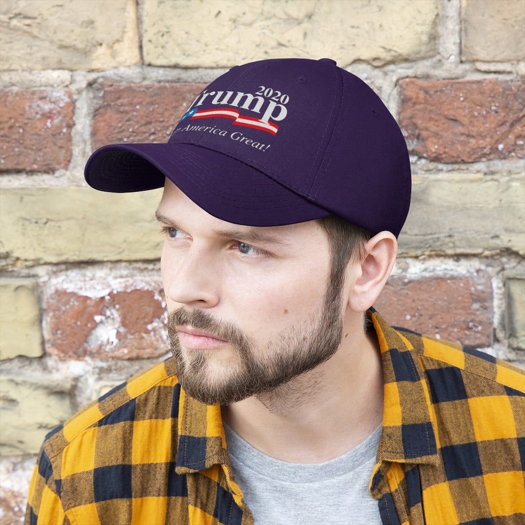 Trump 2020 Keep America Great Twill Cap worn by a man against a brick background.