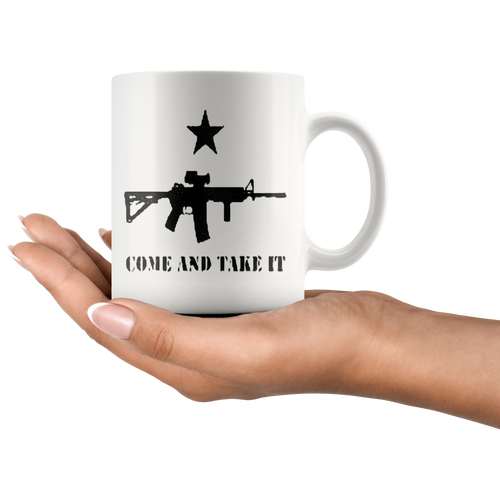 Hand holding Come And Take It Star Over AR-15 Cup with Second Amendment design.
