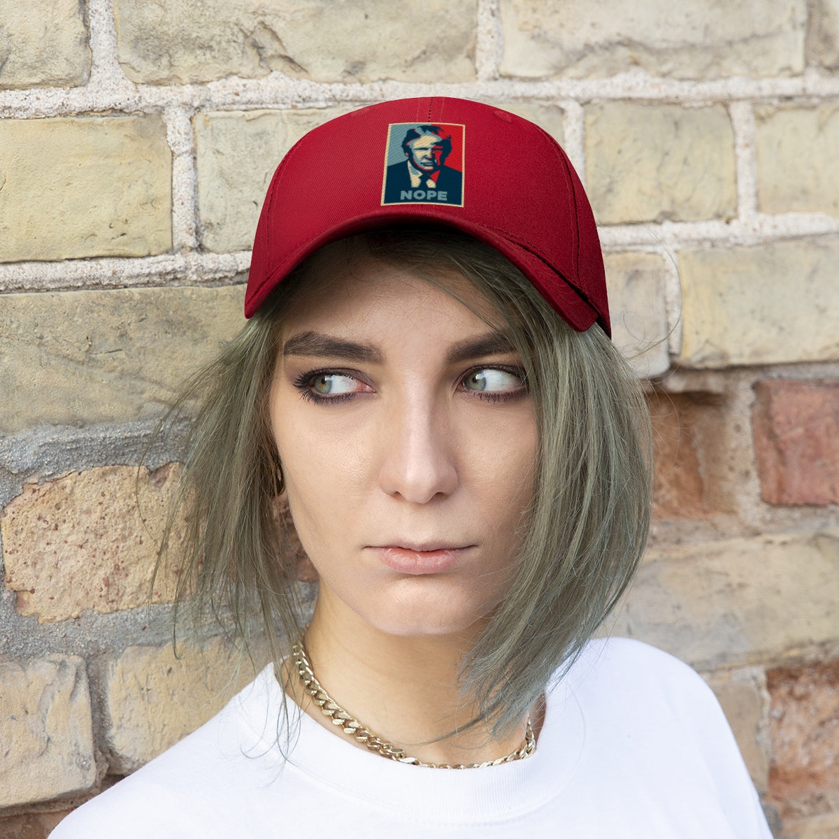 Vintage Nope Baseball Cap Inspired by Trump worn by a young woman, against a brick wall background.