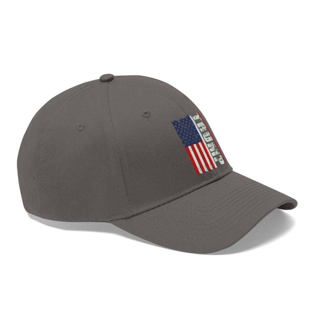 Trump On Verticle Distressed American Flag Twill Cap showcasing a unique American flag design on a gray baseball cap.