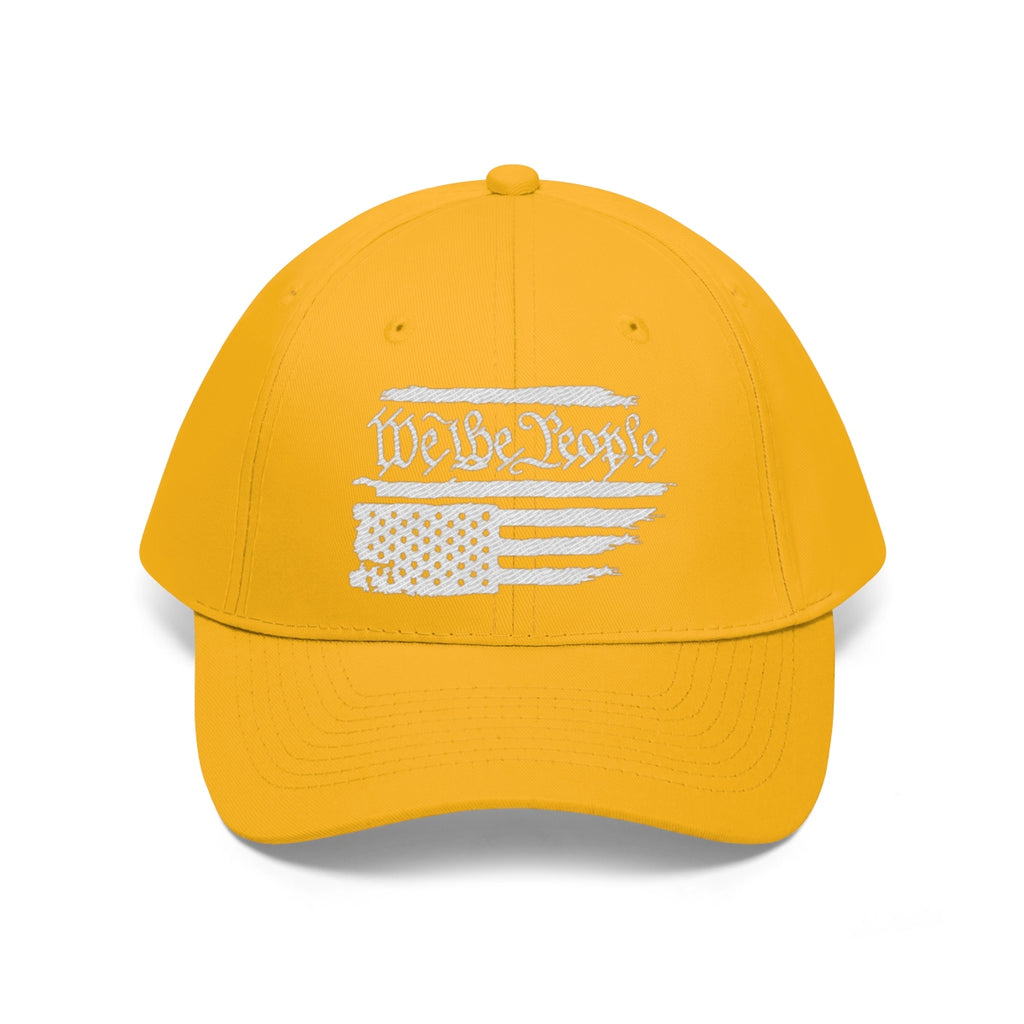 We The People On Distressed American Flag Twill Cap in bright yellow with a white flag design.