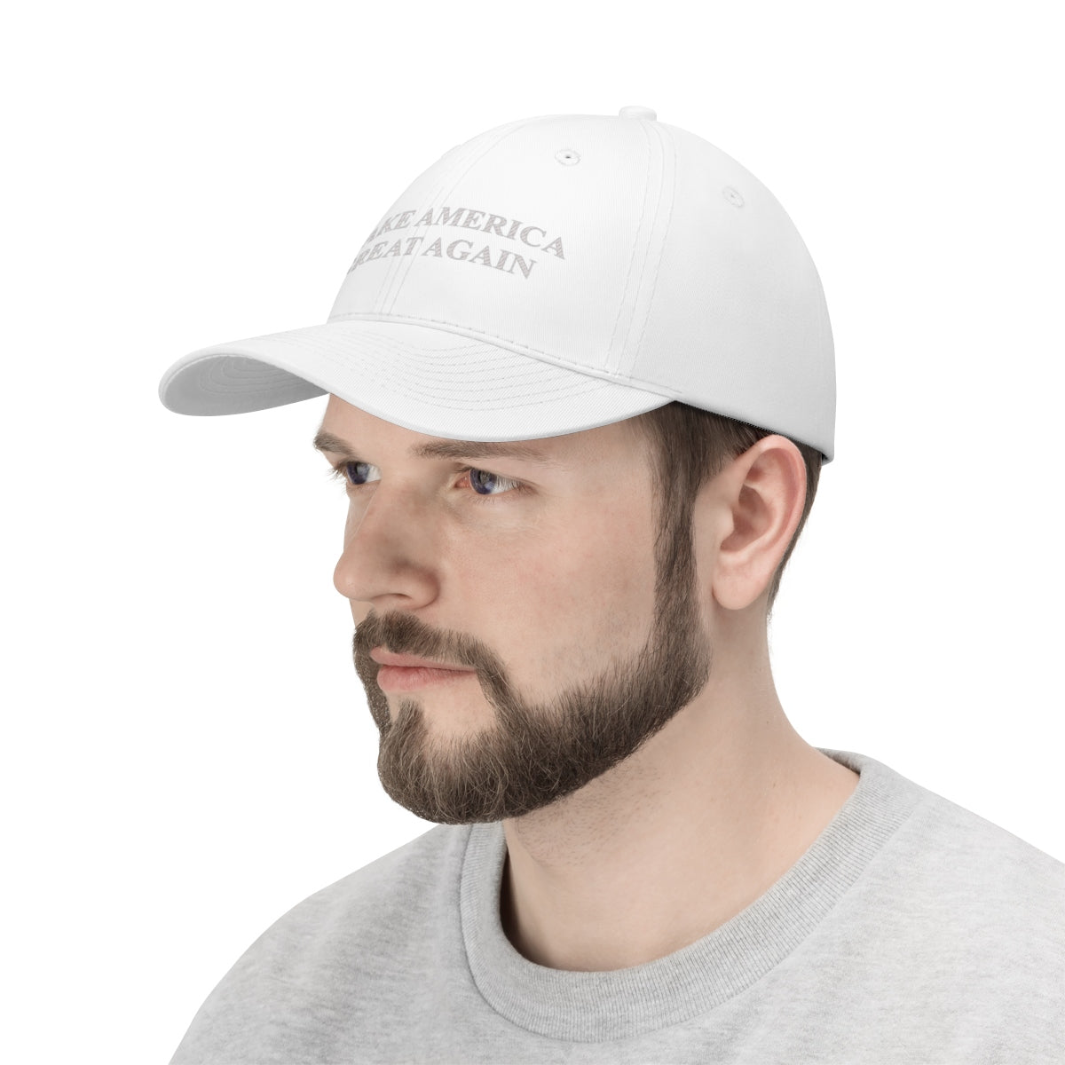 Make America Great Again Twill Cap showcased on a model wearing a light gray sweatshirt.