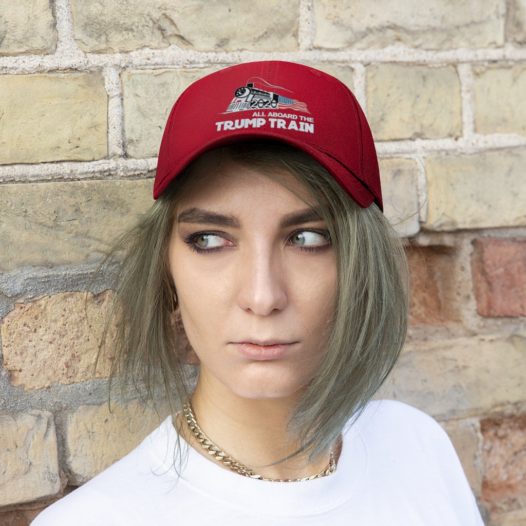 Person wearing a red cap featuring "All Aboard The Trump Train 2020 Twill Cap" embroidered design.