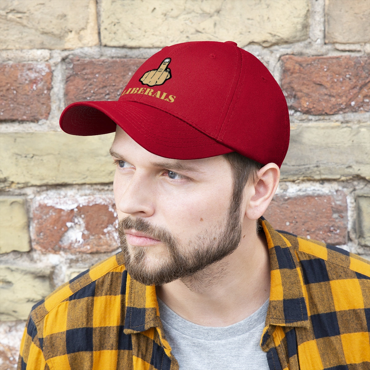 Vintage Fuck Liberals Cotton Twill Cap Design featuring a bold graphic on a red cap worn by a man.