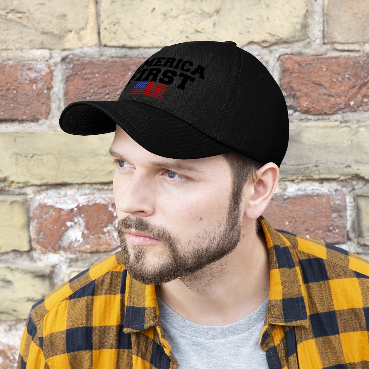 America First Patriotic Twill Cap worn by a man against a brick wall, showcasing national pride.
