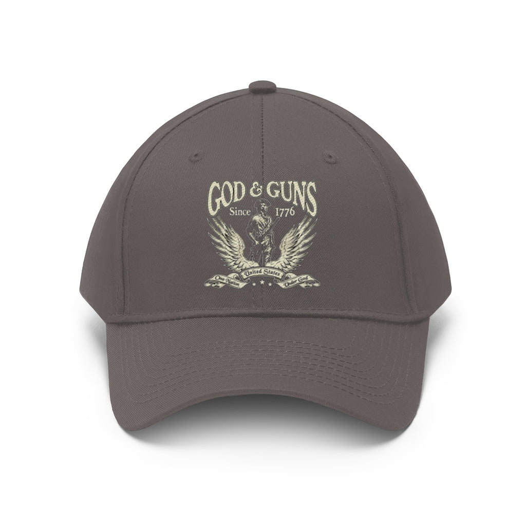 God And Guns Since 1776 Twill Cap in gray showcasing American heritage with emblem and winged design.