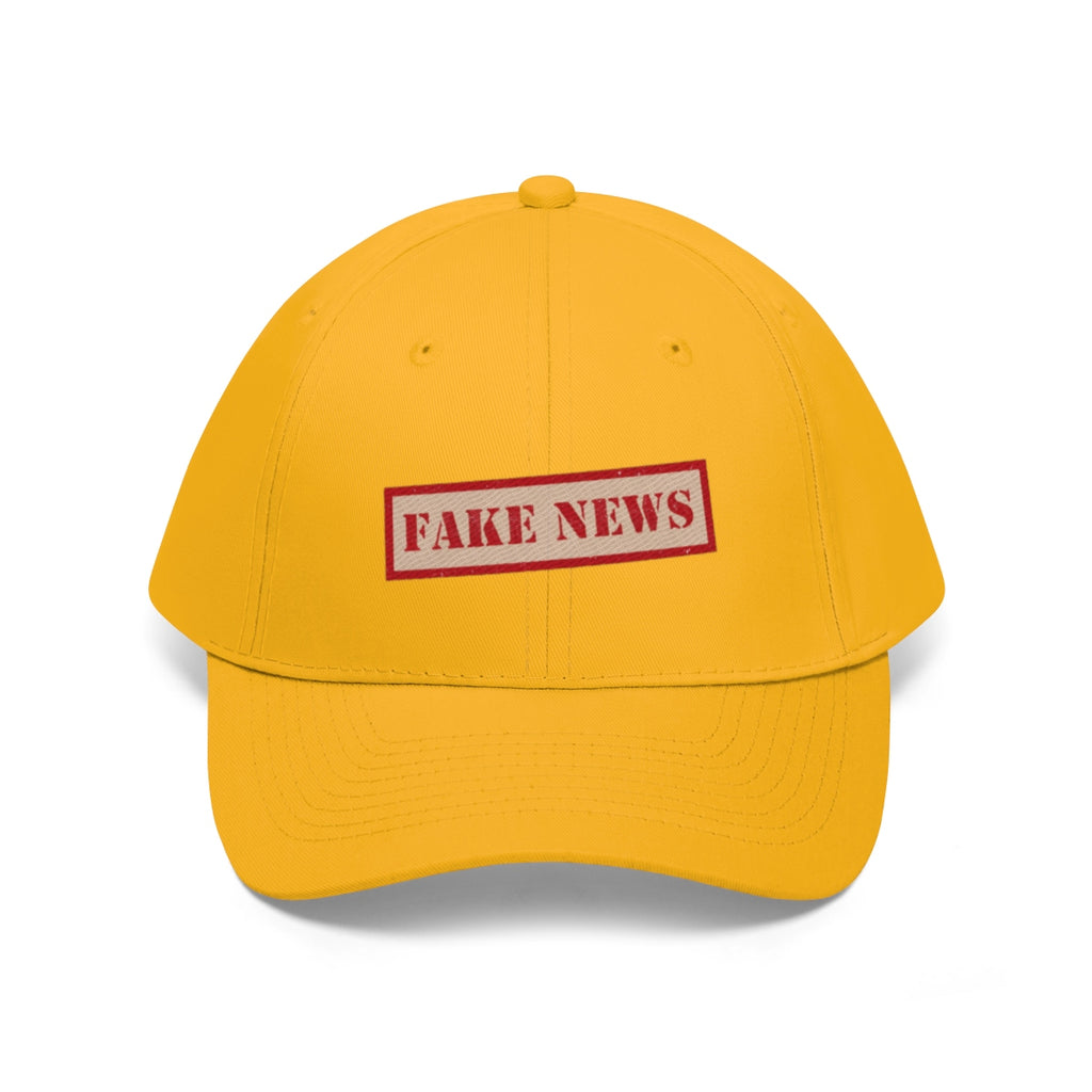 Fake News Twill Cap Bold Humor Casual Wear Hat in vibrant yellow with a playful red 'FAKE NEWS' label.