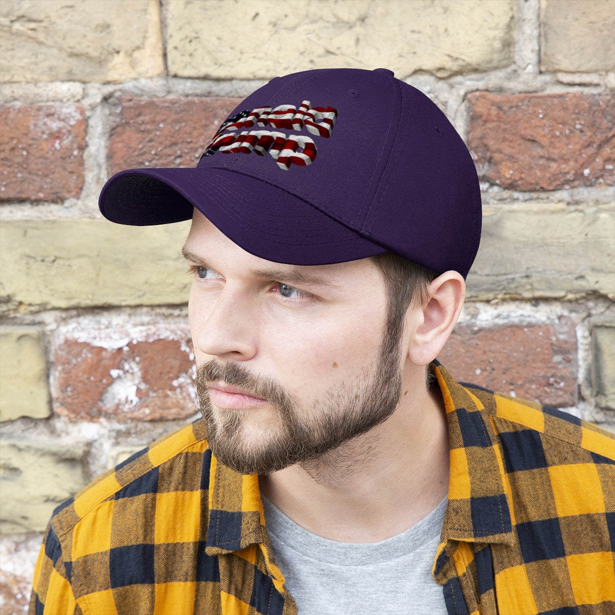 Donald Trump With American Flag Colors Twill Cap worn by a man against a rustic brick background.
