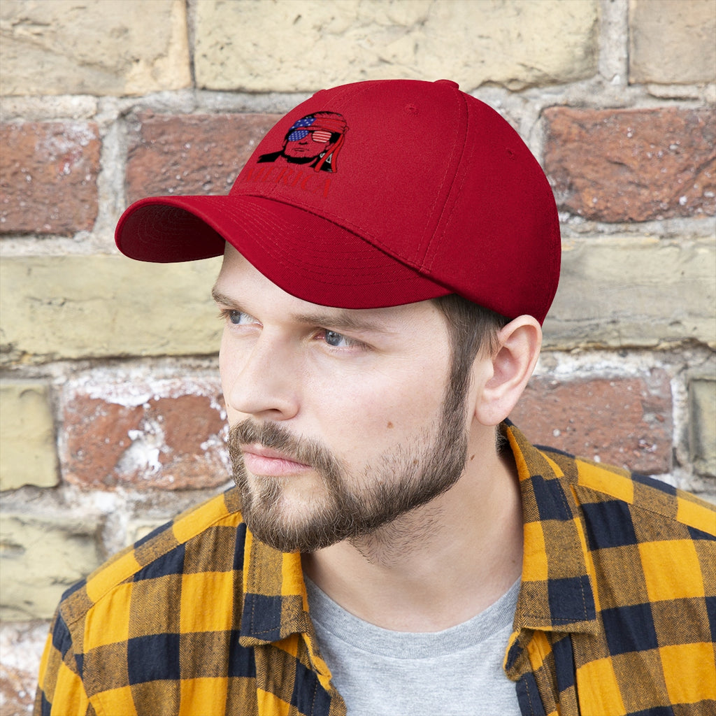 Man wearing a Classic Merica Baseball Cap with Trump Design against a brick wall.