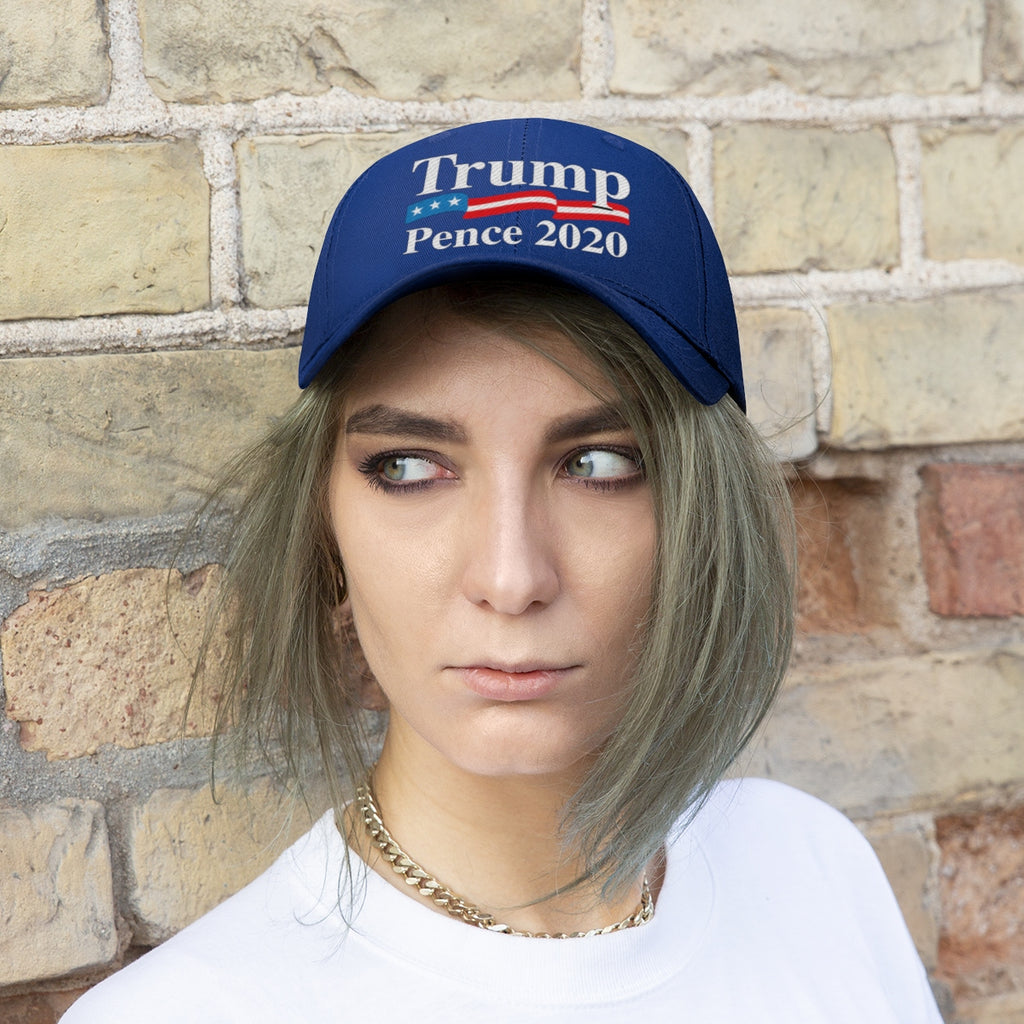 Trump Pence 2020 American Flag Twill Cap worn by a model against a brick wall background.