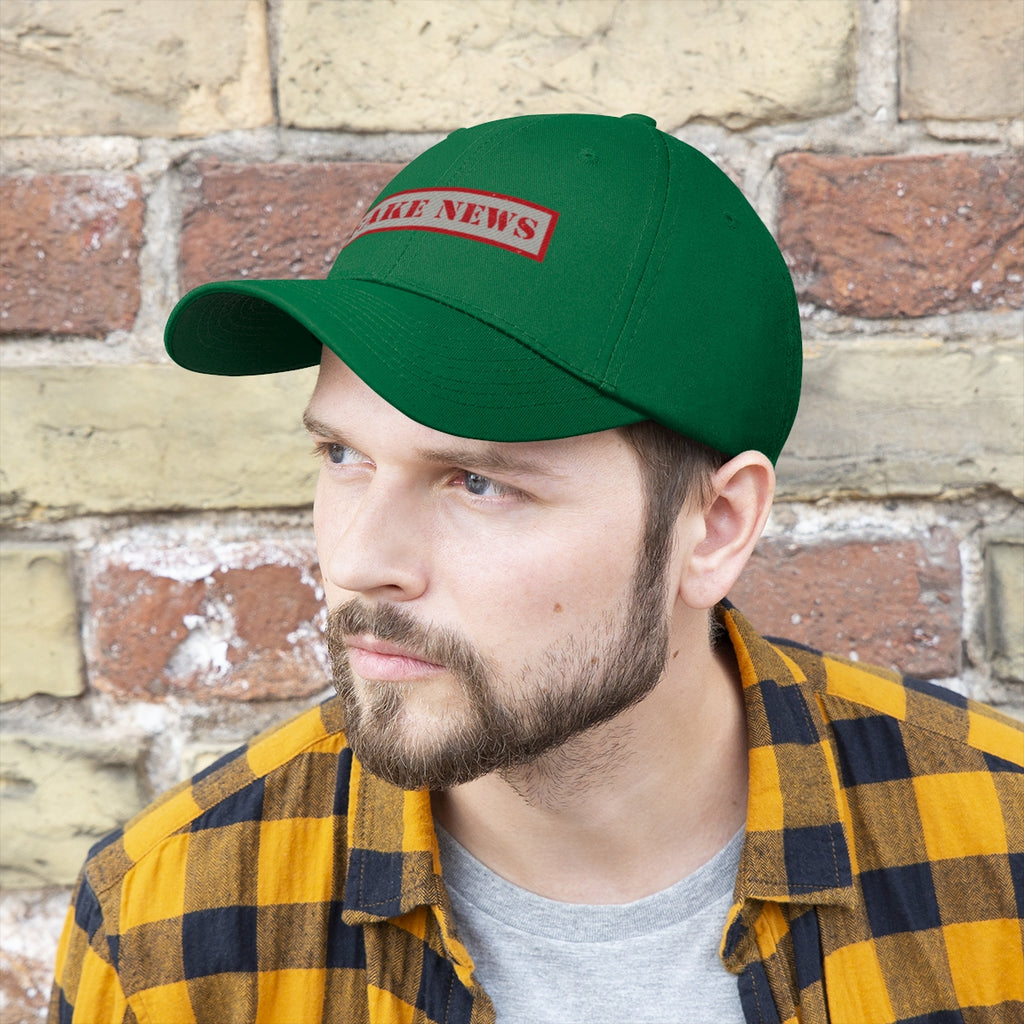 Fake News Twill Cap Bold Humor Casual Wear Hat worn by a man with beard, featuring a vibrant green color and playful design.
