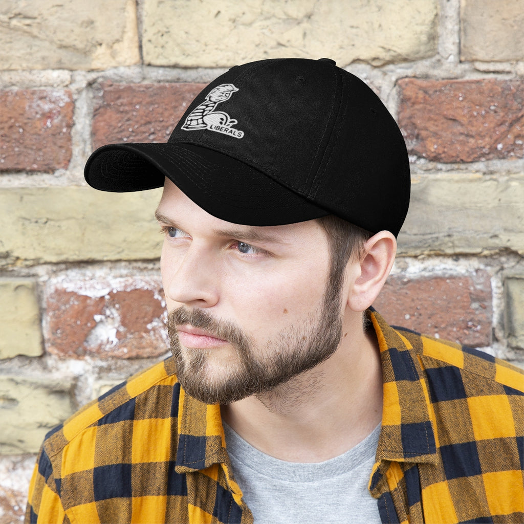 Trump USA Pride Embroidered Twill Cap worn by a man with a beard against a brick wall background.