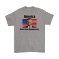 America Under New Management Flag Featuring Trump t-shirt with flag and portrait on gray fabric.