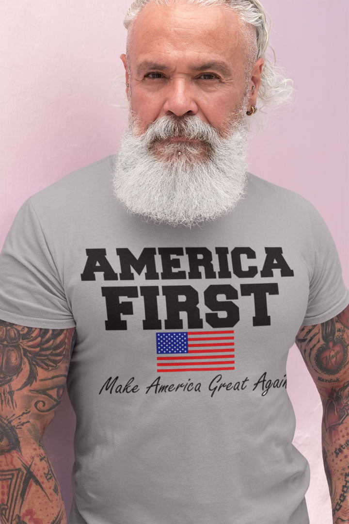 Man wearing 'America First Make America Great Again' t-shirt with American flag