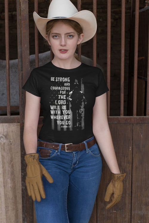 Woman wearing Be Strong And Courageous Lord With You Wherever You Go Tee with cowboy hat and gloves