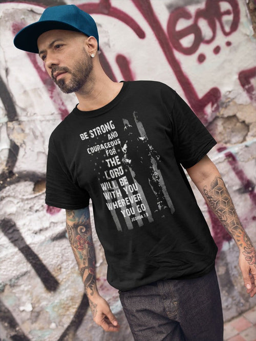Man wearing Be Strong And Courageous Lord With You Wherever You Go Tee with urban graffiti background
