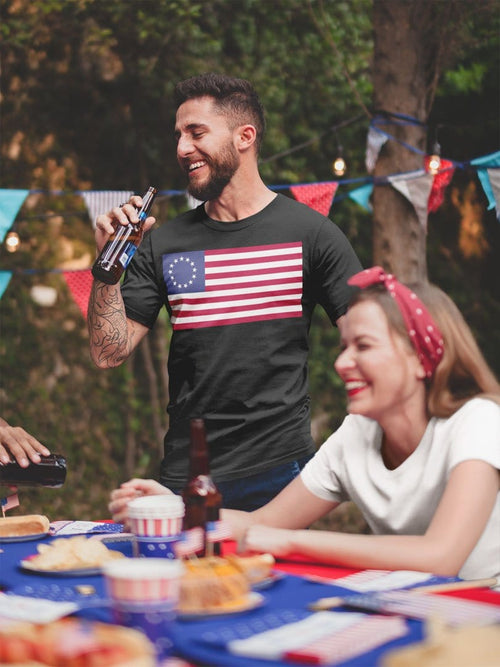 Man wearing Betsy Ross Flag Historic American Flag Graphic Tee at outdoor gathering
