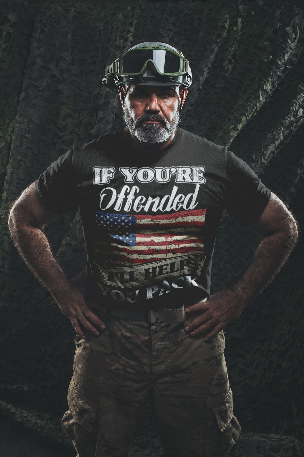 Man wearing Bold Statement Humor Graphic Tee with American flag and text in a confident pose, camo background