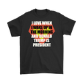Black t-shirt with 'Love Waking Up When Donald Trump Is President' printed in bold text.
