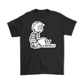 Peeing On Liberals Trump Humor Graphic Tee Shirt in black with satirical design.