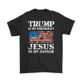 Black t-shirt with 'Trump Is My President Jesus Is My Savior' and American flag design.