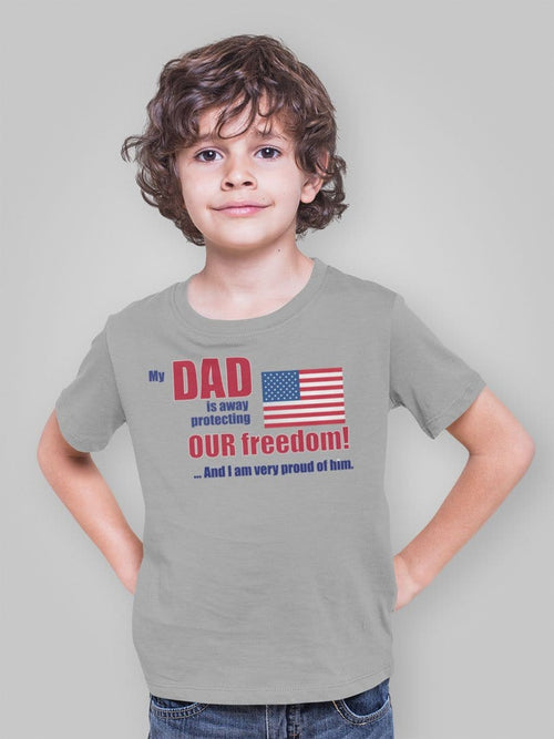 Child wearing Dad Away Protecting Freedom Proud Of Him Graphic Tee with American flag design.