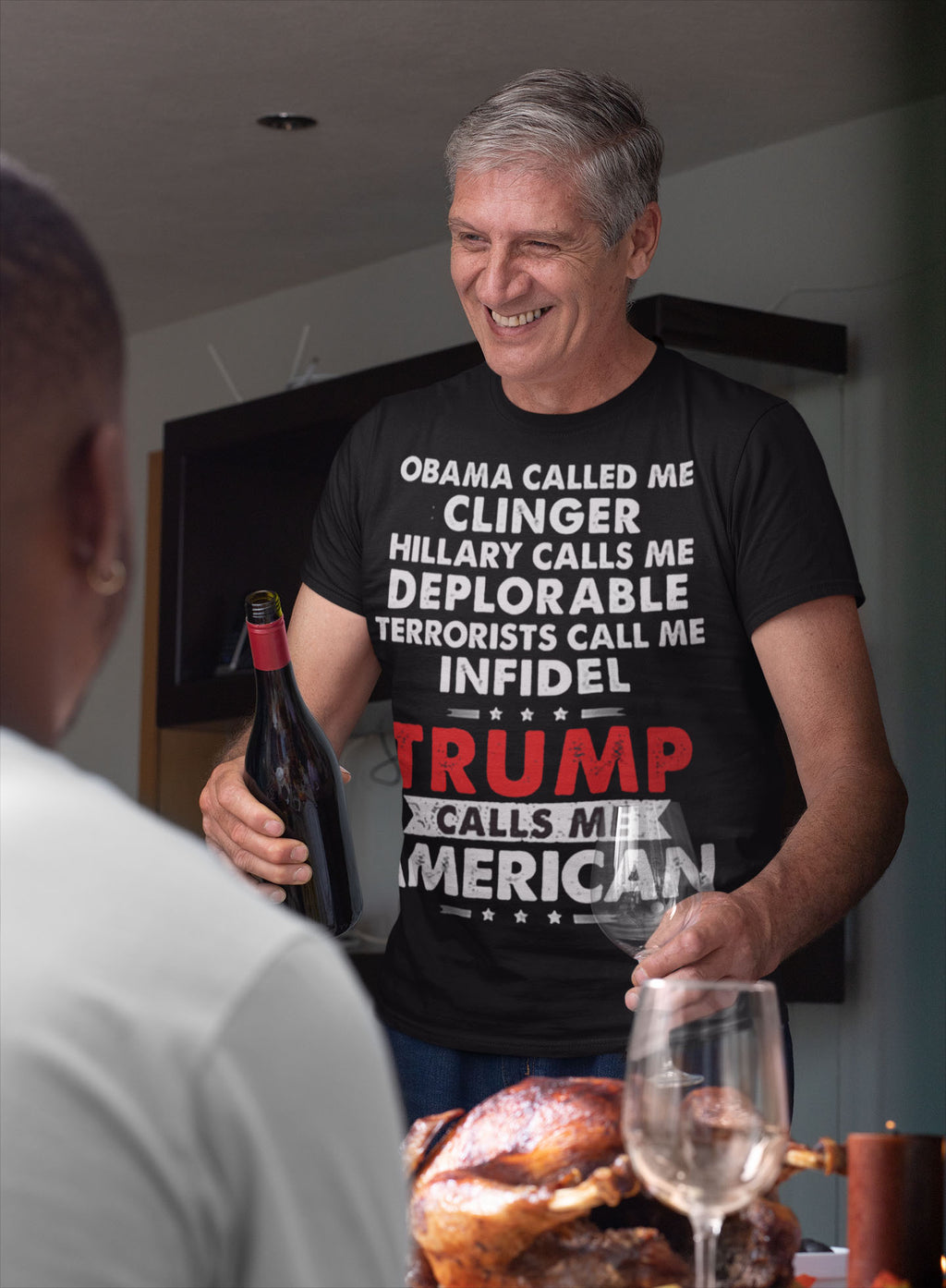 Man wearing "Trump Calls Me American" Patriotic Political Quote Graphic Shirt serving wine at a dinner table.
