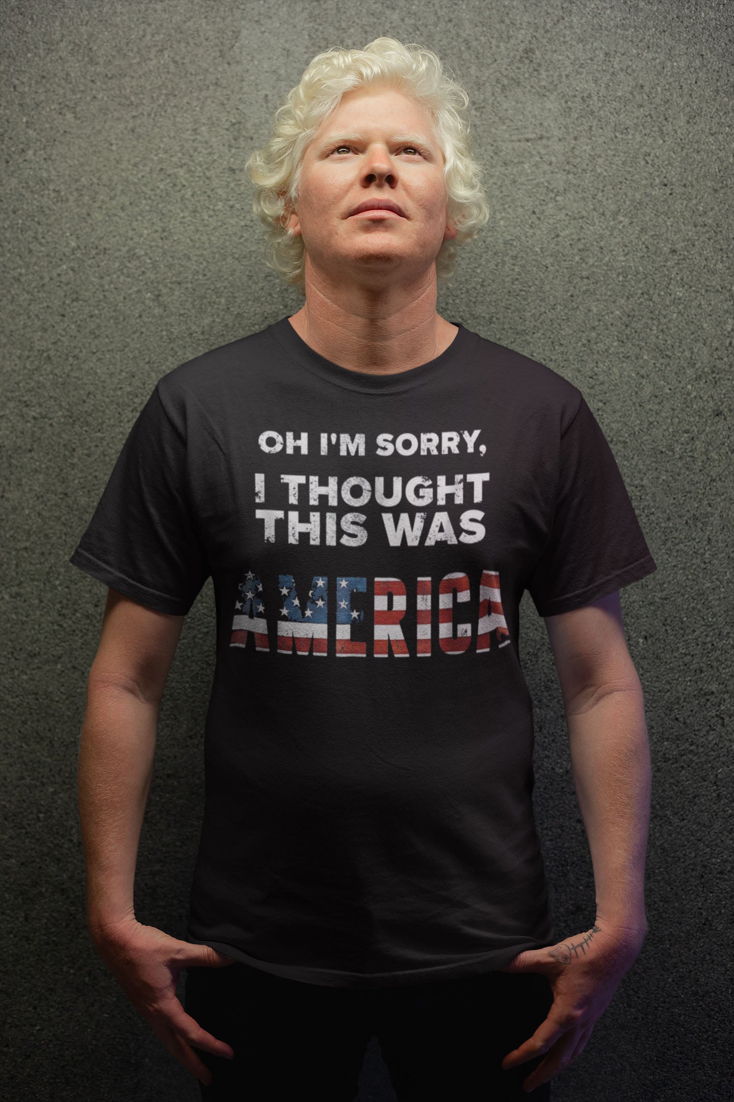 Man wearing "Oh I'm Sorry I Thought This Was America" shirt, showcasing bold cultural humor.