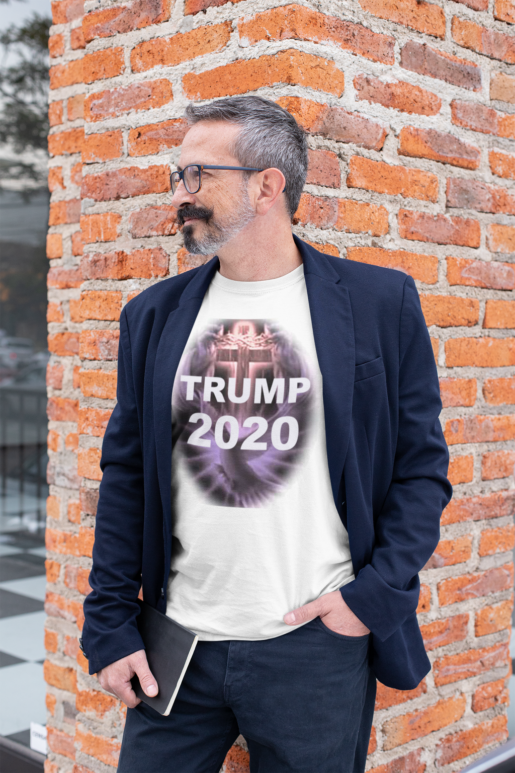 Man wearing a Trump 2020 Cross & Dove Faith Shirt with a blazer, posing against a brick wall.