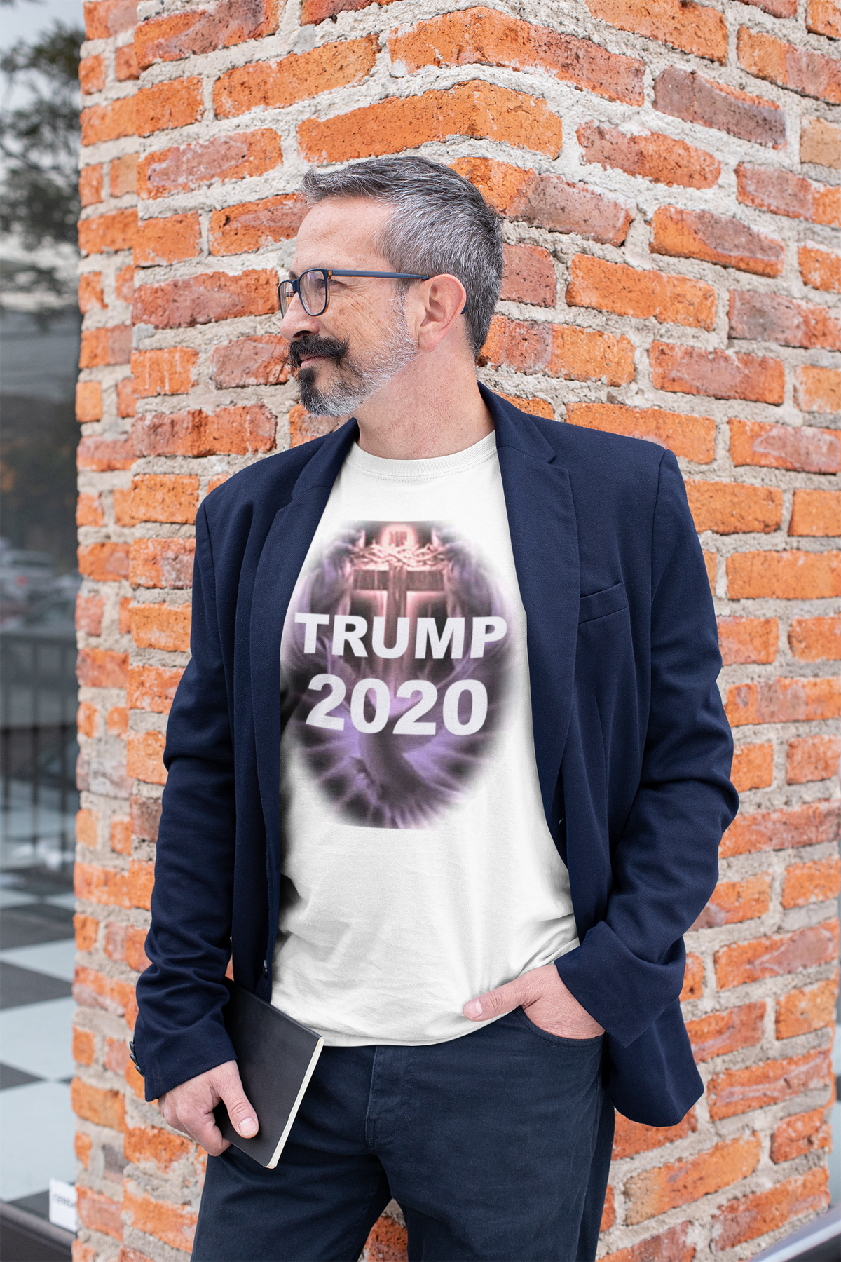 Man wearing a Trump 2020 Cross & Dove Faith Shirt with a blazer, posing against a brick wall.