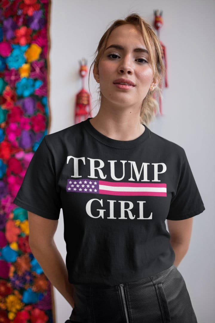 Girl wearing Girl Trump Bold Supporter Graphic Tee Shirt with American flag design, perfect for political rallies and casual events.